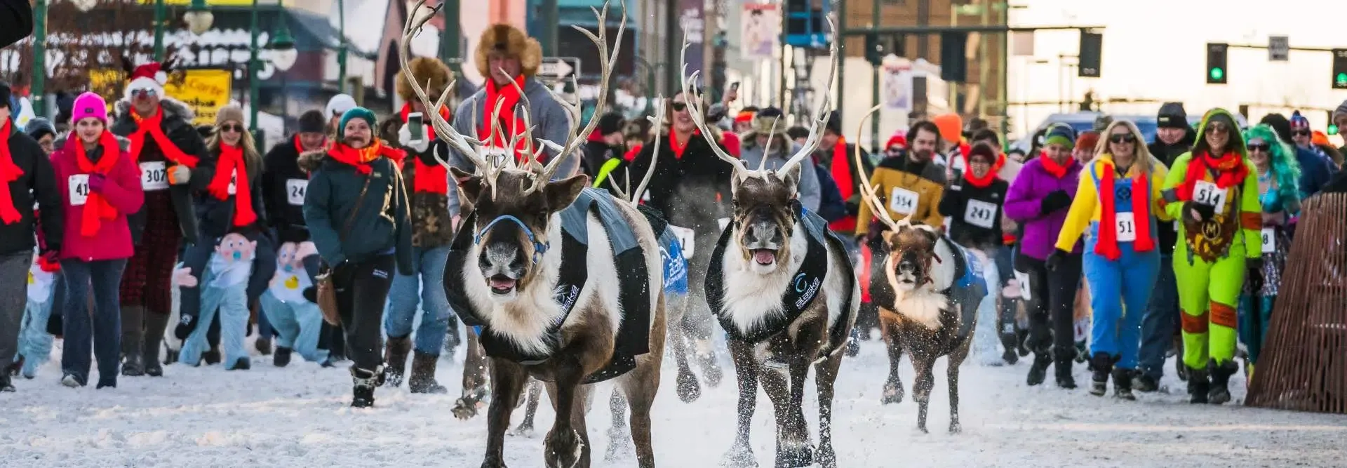 Alaska events and festivals backdrop featuring scenic Alaskan landscapes and cultural celebrations