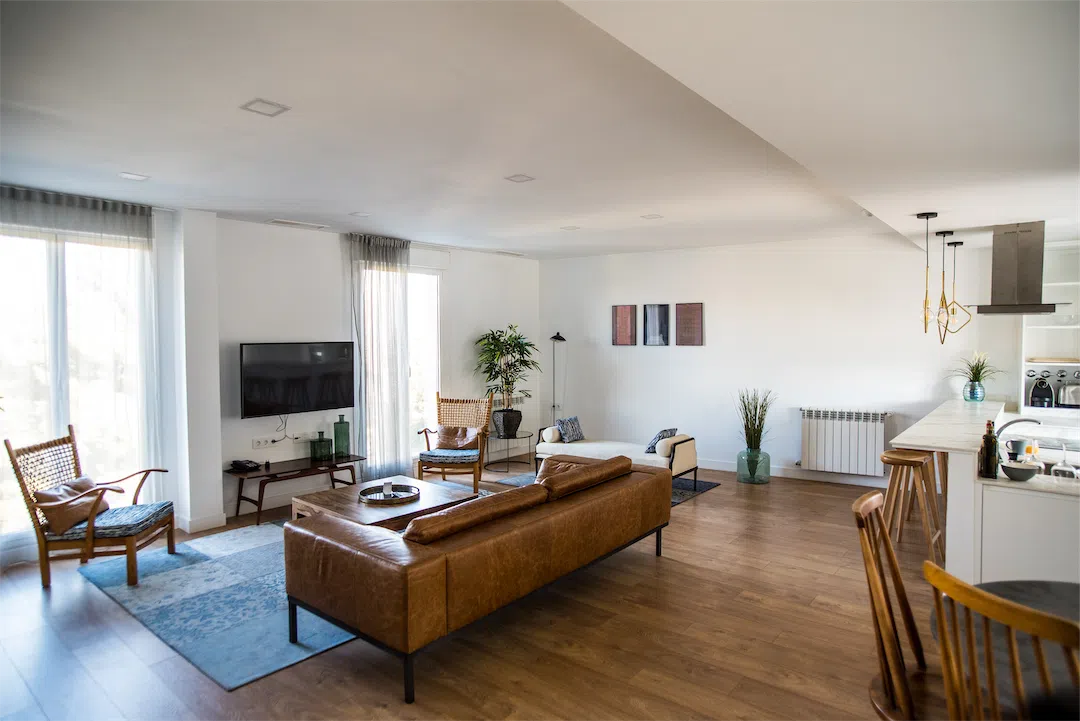 The beautiful interior of a modern living room, an example of a well-maintained investment property.